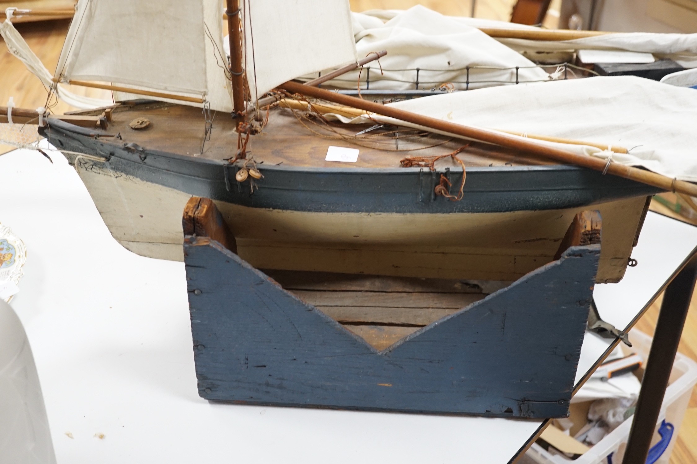 Two large over-painted pond yachts, largest 91cms